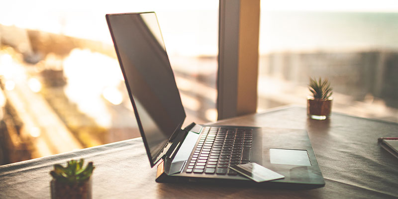 Laptop in sunny office space