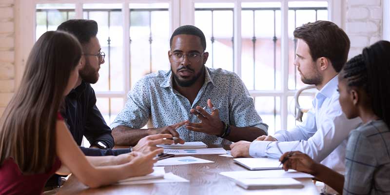 Image of coworkers hosting a meeting