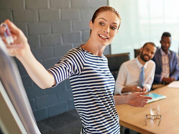 Working presenting at a meeting