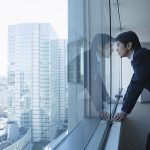 Man looking out a window