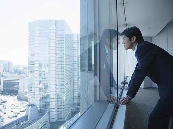 Man looking out a window